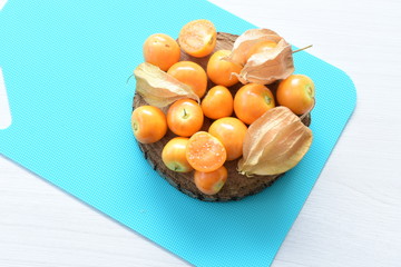  natural cape gooseberry on wooden background
