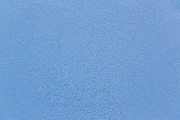 Blue sheet of cardboard paper with rough surface texture background. Textures on the blue wall use for background. Empty interior with blue wall or a blue floor.