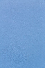 Blue sheet of cardboard paper with rough surface texture background. Textures on the blue wall use for background. Empty interior with blue wall or a blue floor.
