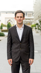 Portrait of caucasian man standing in front of the mosque