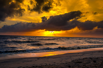 The blurred natural background of the blue sky by the large lake, with the sea rolling over the beach all the time,can be seen during the summer season