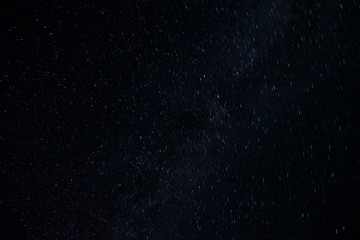 Astro Photography. Background Of Stars Traces Revolving Around The North Pole By Circular Trails Against Night Black Sky.