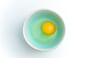 Fresh eggs in a blue porcelain bowl.Healthy,breakfast