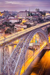 Travel Concepts and Ideas. Dom Luis I Bridge in Porto in Portugal During Golden Hour With Passing Metro Lanes.