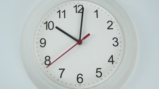 The beginning of time 10.03 am or pm, Closeup White wall clock Red second hand minute Walk slowly, Time concept.