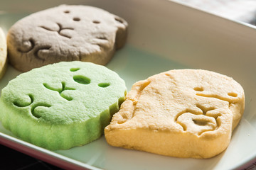 Colorful cookies on a wooden background