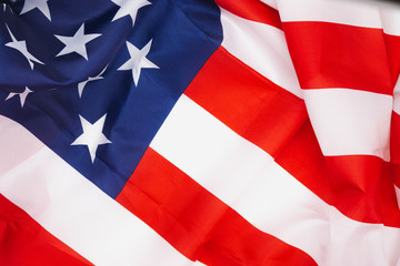 US American flag on white background. For USA Memorial day,  Memorial day, Presidents day, Veterans day, Labor day, Independence day, or 4th of July celebration. Top view, copy space for text.