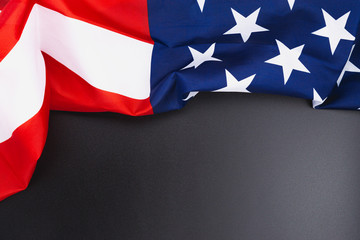 US American flag on black background. For USA Memorial day,  Memorial day, Presidents day, Veterans day, Labor day, Independence day, or 4th of July celebration. Top view, copy space for text.