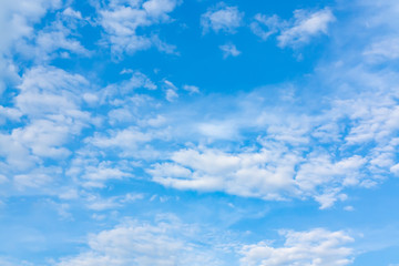 Naklejka na ściany i meble Light cumulus clouds in the blue sky on a sunny day, full frame image, background