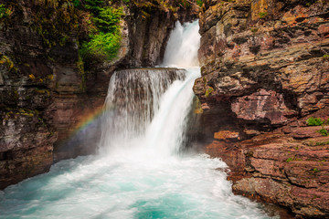 Fototapeta na wymiar Rainbow on Saint Mary Falls, Glacier National Park