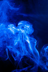 Blue smoke motion on black background.