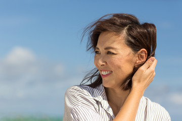 Portrait of a happy Asian woman smiling.