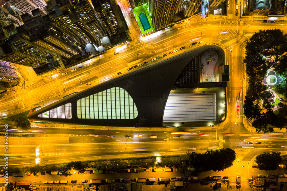 Wall mural Aerial view of city at night with Light Track