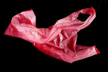 red plastic bag  isolated black background