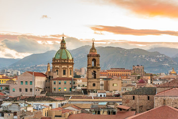 Fototapeta na wymiar Italy, Sicily, Palermo Province, Palermo. The dome and bell tower of the baroque Chiesa del Gesù, or Church of the Jesus, in Palermo.