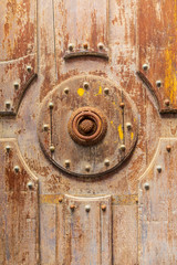 Italy, Sicily, Palermo Province, Cefalu. Detail of an exterior wooden door on the Cefalu Cathedral, a UNESCO World Heritage site.