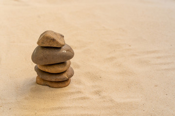 Fototapeta na wymiar Concept of stacking stones on the beach.