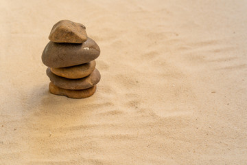 Fototapeta na wymiar Concept of stacking stones on the beach.