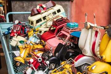 Italy, Sicily, Palermo Province, Castelbuono. Old toys for sale from a street vendor in Castelbuono.