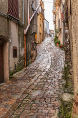 Obraz na płótnie Canvas Italy, Sicily, Palermo Province, Geraci Siculo. Winding narrow cobblestone street in the town of Geraci Siculo.