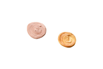 Liquid body and face highlighter isolated on white background. Golden and beige color.