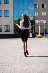 Young brunette woman calling by phone