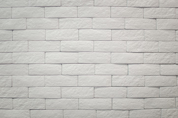 A white brick wall textured and background. Clean concrete grid white bricks design stack.