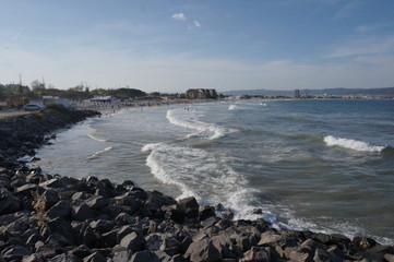 Sea waves running on stones, summer vacation.