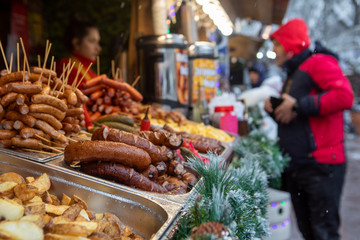 fast street food close up sausages potatoes at store shelf