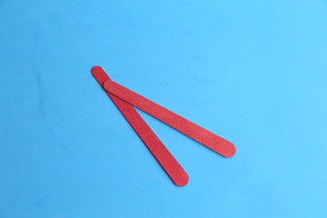 Nail file on colorful background