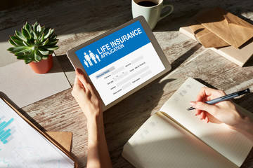 Life insurance online application form on device screen.