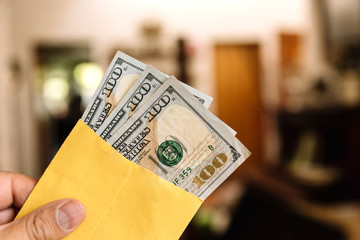 Bills on a wooden table, counting money