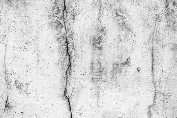 Fototapeta premium Texture of a concrete wall with cracks and scratches which can be used as a background