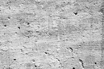 Texture of a concrete wall with cracks and scratches which can be used as a background