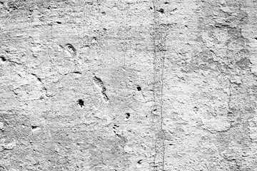 Texture of a concrete wall with cracks and scratches which can be used as a background