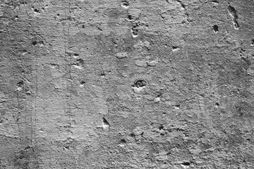 Texture of a concrete wall with cracks and scratches which can be used as a background