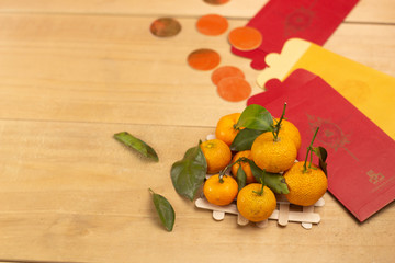 Fresh mandarin orange with leaf on wooden, white background.selective focus