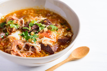 Northern Thai food (Kanom Jeen Nam Ngeaw), rice noodles with spicy soup in a bowl
