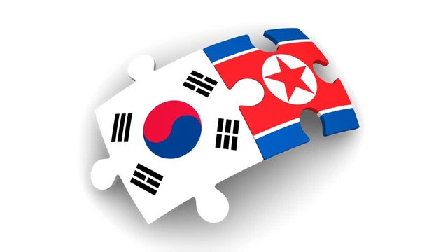 Cooperation between North and South Korea. Puzzles with flags of North and South Korea comes together. The concept of coincidence of interests in geopolitics. Footage video