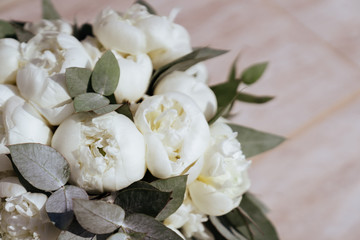 Naklejka na ściany i meble Close-up image of a beautiful and stylish wedding bouquet of white and pink peonies. Summer floral composition.