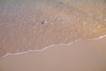 Sea wave on the sand beach