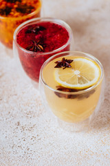 Colorfull herbal tea on a light wooden background