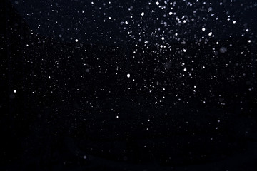 Fototapeta premium snow on a black background. snow texture