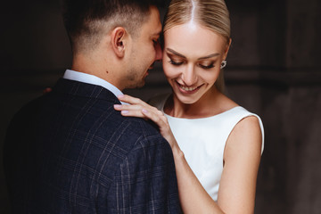 Happy bride and groom near old castle in wedding day