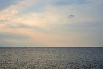 Overcast sky over the sea on a summer evening near the coast of Sicily. Natural background