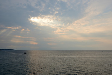 Obraz premium Overcast sky over the sea on a summer evening near the coast of Sicily. Natural background