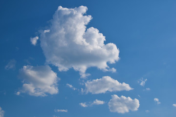 Fluffy clouds against the blue sky