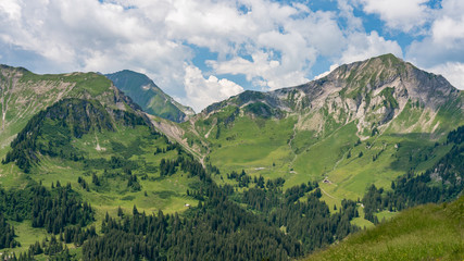 Fototapeta na wymiar Switzerland, Panoramic view on green Alps near Schynige Platte, Saxeten valley