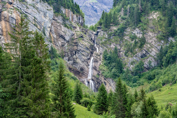 Fototapeta na wymiar Switzerland, scenic view on waterfall near Schynige Platte, Saxeten valley