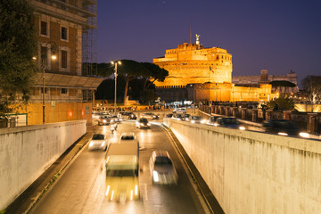 Rome, Italy - Dec 30, 2019: Castel Sant Angelo in Italy Rome at night with traffic light trails